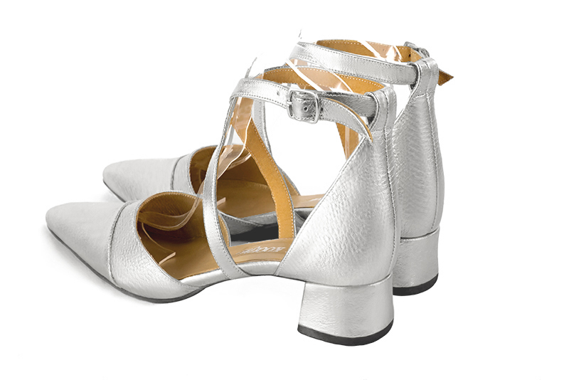 Light silver women's open side shoes, with crossed straps. Tapered toe. Low flare heels. Rear view - Florence KOOIJMAN